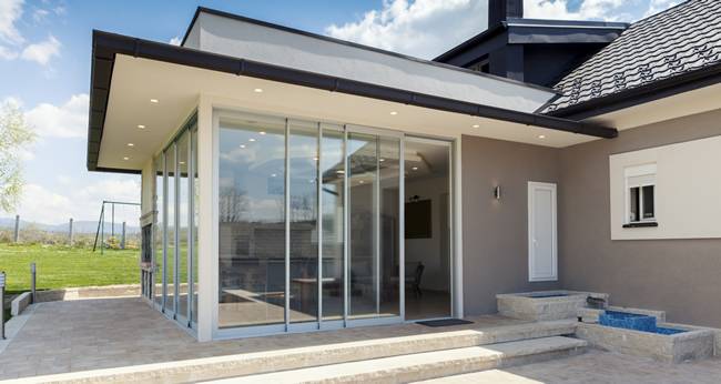 Aluminium bi folding door part of modern home extension