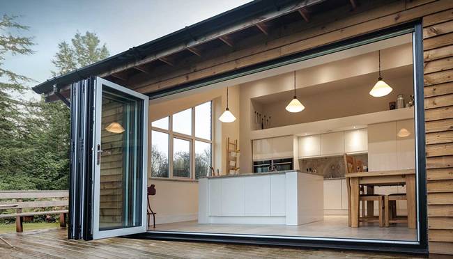 Open aluminium bi folding doors showing modern luxury domestic interior